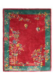 Antique Chinese Art Deco Walter Nichols rug, 138x106 inches, featuring an ornate floral and botanical pattern in vibrant red and green hues.